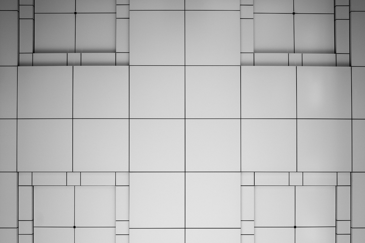 Handheld shower on a slide bar against gray tile
